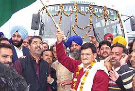 Punjab Transport Minister Mohan Lal flags off 25 buses under the PUNBUS scheme at Pathankot bus stand on Sunday.
