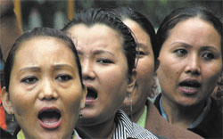 Members of Tibetan Women's Association during a rally to mark the 48th anniversary of National Tibetan Women's Uprising Day, in the Capital