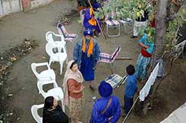 Nihangs try to take possession of a disputed property in Patiala on Monday. 