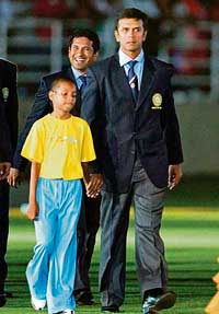Sachin Tendulkar with captain Rahul Dravid (right) during the opening ceremony in Trelawny. 