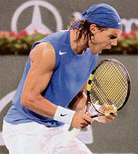 Spains Rafael Nadal celebrates after breaking the serve of compatriot Fernando Verdasco during their third-round match at the Pacific Life Open tennis tournament in Indian Wells, California