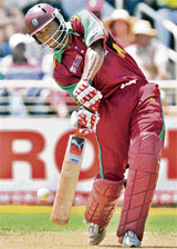 Marlon Samuels of the West Indies hits a boundary during a World Cup first round match against Pakistan at the Sabina Park cricket ground in Kingston 