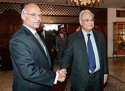 Indian foreign secretary Shiv Shankar Menon (left) shakes hands with his Pakistani counterpart Riaz Mohammed Khan upon arrival at the foreign ministry in Islamabad on Tuesday. 