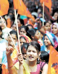 Anganwadi workers holding a rally to press for their demands, in the Capital