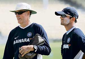 Rahul Dravid (right) and Greg Chappell watch team members during a training session at Sir Frank Worell Ground at the University of West Indies in Port of Spain (Trinidad and Tobago) on Tuesday. 