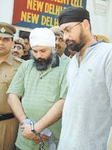 The accused in police custody.