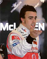 McLaren Formula One driver Fernando Alonso of Spain talks to his pit crew during the first day of practice in Melbourne
