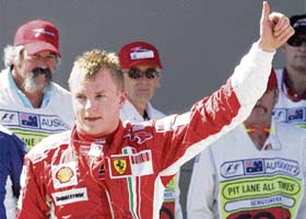 Ferrari Formula One driver Kimi Raikkonen of Finland celebrates after he won the pole position during the qualifying round in Melbourne