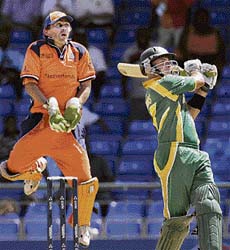 South Africas Herschelle Gibbs hits a six off Netherlands Daan van Bunge during their World Cup match in Basseterre