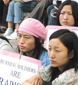 Burmese women holding a demonstration in protest against the alleged gangrape of four schoolgirls by soldiers at Putao