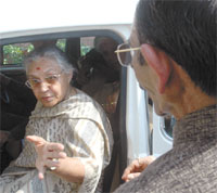 Delhi Chief Minister Sheila Dikshit having a word with DPCC president Ram Babu Sharma after a meeting with candidates for the forthcoming MCD polls