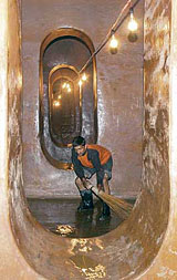 A Municipal Corporation worker cleans the underground Heritage Water Tank on the Ridge Maidan, Shimla, on Monday. The civic body has undertaken this exercise after nine years.