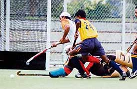 A match being played between Namdhari XI and EME XI, Jalandhar during the All India Guru Gobind Singh Gold Cup Hockey Tournament at the PAU in Ludhiana on Monday.