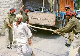 A labourer at the receiving end of a police lathicharge near the circuit house in Bathinda on Monday.