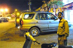 In violation of district administration guidelines an employee of a dhaba in khaki directs visitors to the parking area on the Income Tax Colony road in Jalandhar