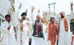 BJP candidate from Adarsh Nagar Neelam Buddhiraja campaigning along with senior BJP leaders Vijay Goel and Pawan Sharma