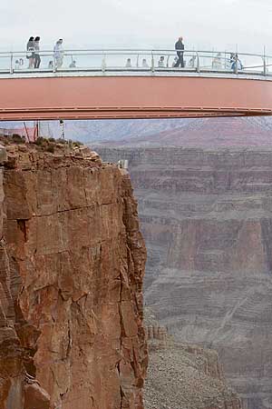 A grand view of the grand Canyon: Astronaut Buzz Aldrin (right) and other VIP  guests take the ceremonial first steps on the Skywalk at Grand Canyon West on the Hualapai Indian Reservation in Arizona on Tuesday. The $ 30 million glass-bottomed walkway juts out 70 feet from the rim at an evelation of 4,000 feet above the Colorado River.
