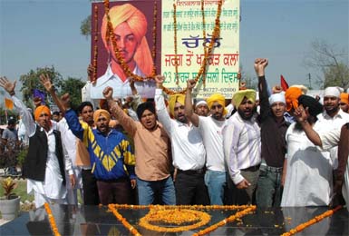 A youth jatha from Jarg village raises Inqalab Zindabad slogan at the memorial of Bhagat Singh at Khatkar Kalan in Nawanshahr on Friday