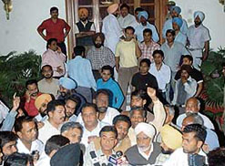 Congress workers outside the Moti Bagh palace residence of Capt Amarinder Singh in Patiala following rumours of a vigilance raid on Saturday.