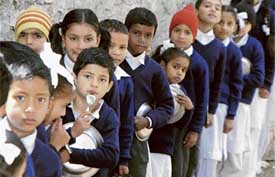 Kids line up for the meal in a school in Chaura Maidan, Shimla