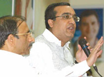 Union Minister of State for Urban Development Ajay Maken addressing the press conference while DPCC president Ram Babu Sharma looks on.