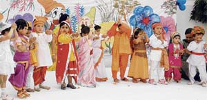 Students of HollyHock School present a cultural item at a farewell function held