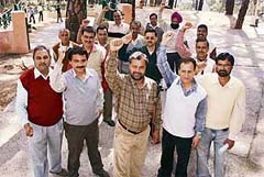 BSNL employees hold a demonstration at Dharamsala on Monday. 