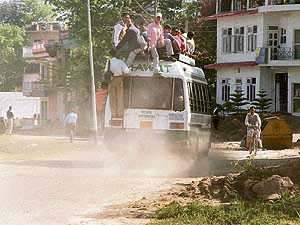 Passengers travelling on the rooftop of buses is a common sight in interior areas of the hill state.