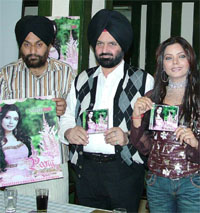 Lyricist Shamsher Singh Sandhu (centre) with Satwinder Satti whose maiden cassette "Peeng was released in Jalandhar.