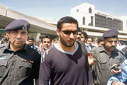 Pakistans Shahid Afridi arrives at the Karachi airport on Wednesday.