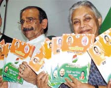 Delhi Chief Minister Sheila Dikshit and president of Congress partys Delhi unit Ram Babu Sharma releasing the party manifesto for the forthcoming MCD polls