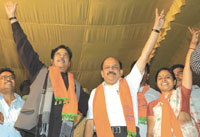 BJP candidate from Burari, Rekha Sinha, waving to crowds at a public