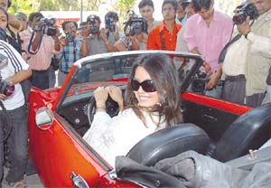 Bollywood star Mahima Chowdhary posing for the photographers on a vintage car during the Haig Vintage Rally in the Capital on Sunday