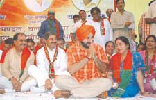 BJP MP from Amritsar, Navjot Singh Siddhu, and former MP from Karol Bagh, Anita Arya, with party candidate Gulshan Bhatia during a campaign rally for the MCD election in the Capital on Sunday