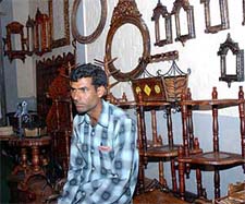 A craftsman at one of the stalls at the Oasis Kraft Mela in Karnal on Sunday.