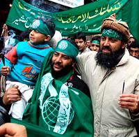 Kashmiri Muslims shout Islamic and pro-freedom slogans during a religious procession in Srinagar on Sunday. Dozens of demonstrators were detained. Tribune photo by Mohd Amin War