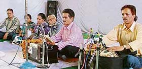 People sing bhajans during the Arya Samaj Founder Day in Ludhiana