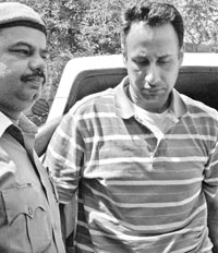 Avtar Singh Grewal, who allegedly killed his wife in the USA, in police custody soon after his arrival at the IGI International Airport in New Delhi on Saturday.