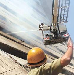 Firemen at the site of a fire that broke out at the NDMC office in Connaught Place