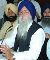 Rural development and panchayat minister Ranjit Singh Brahmpura addresses a press conference in Jalandhar on Monday.