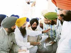 Sharanjit Singh Dhillon, MP and president of AIYAD, listens to the problems of people in a sangat darshan at Sodhiwal village near Bet Sidhwan in Jagraon