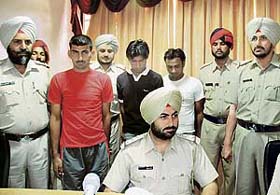 Three alleged criminals, who were nabbed by the Bathinda police, being produced before the media