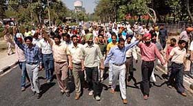 Members of the Punjabi University Students Confederation hold a protest march in support of their demands on the university campus in Patiala