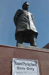 An advertisement poster pasted on the statue of Pandit Jawaharlal Nehru in the Nehru Shoping Complex at Lawrence Road in Amritsar.
