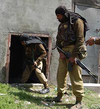 Soldiers search a house in Srinagar on Tuesday.