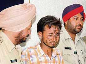 Accused in the acid attack case Balkar Singh is produced before the media in Ludhiana on Tuesday.
