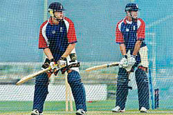 England captain Michael Vaughan (right) and his team-mate Andrew Flintoff bat during a practice session in St. Johns.
