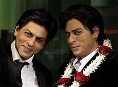 Bollywood star Shah Rukh Khan (left) stands next to his waxwork model at Madame Tussauds in London on Tuesday.