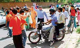 Parents and students of Class VIII of Government Model Senior Secondary School, Sector 33, block traffic in protest against the denial of admission to the next class due to the Smart School concept in Chandigarh on Wednesday.
