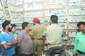 A police team conducts a search at Imperial Medical Hall near Company Bagh in Jalandhar